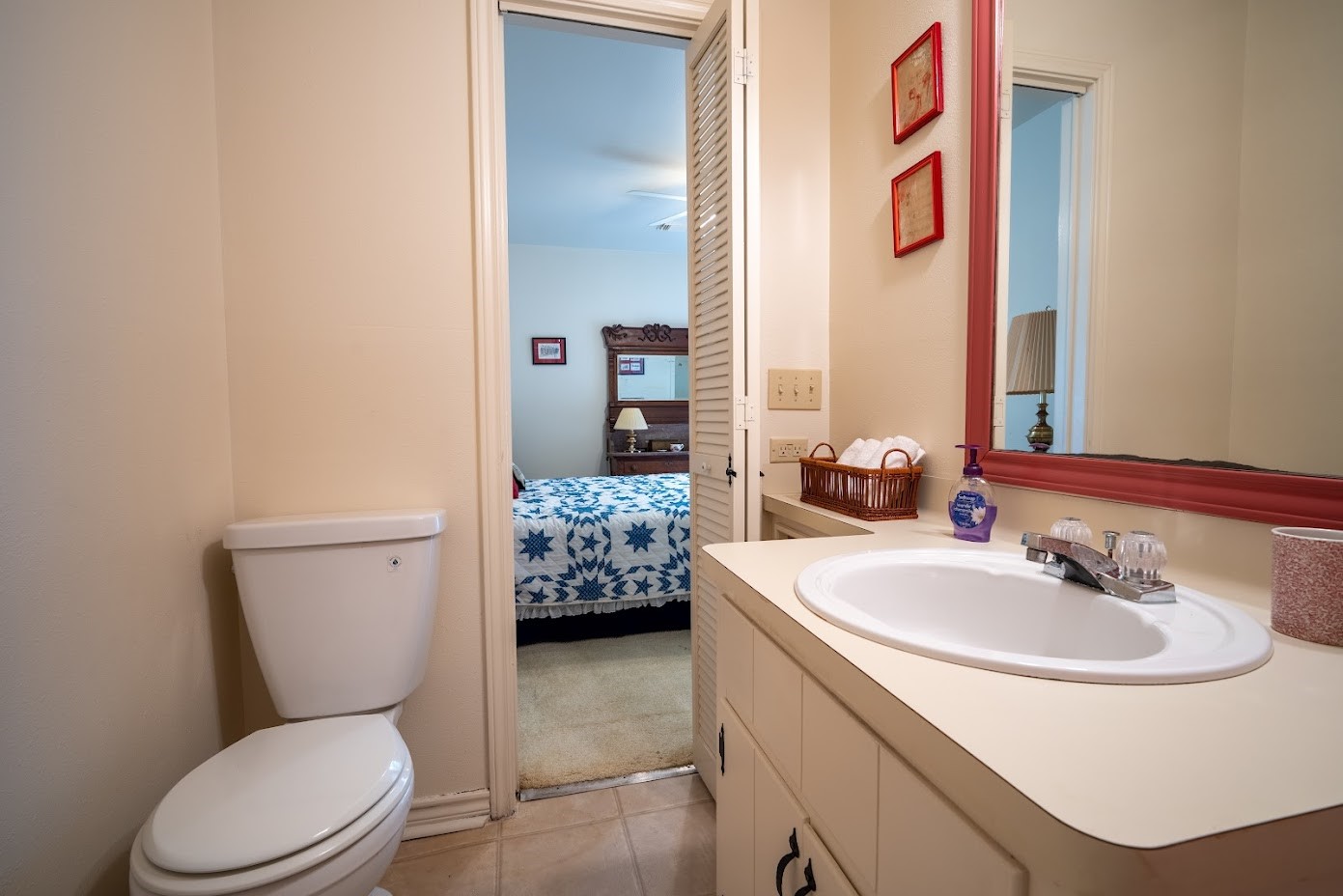 565 Timber Bay Drive Trinity, TX 75862 - Photo 28 of 49 a bathroom with a toilet sink and mirror