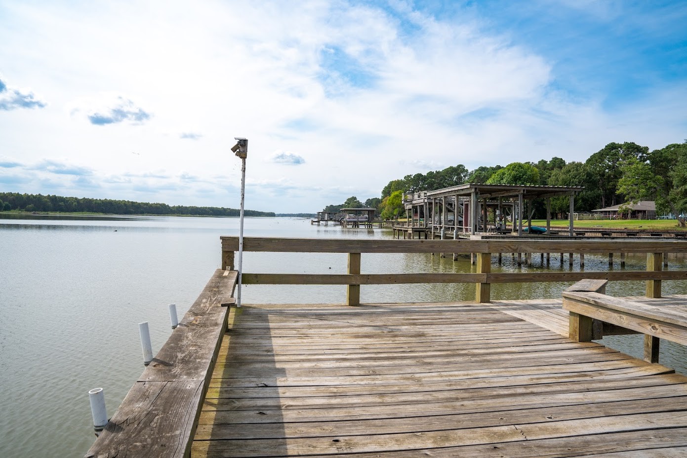 565 Timber Bay Drive Trinity, TX 75862 - Photo 45 of 49 a view of a lake with boats and trees in the background