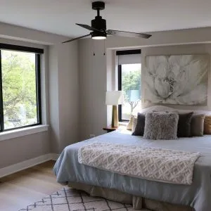 a bedroom with a large bed and a window