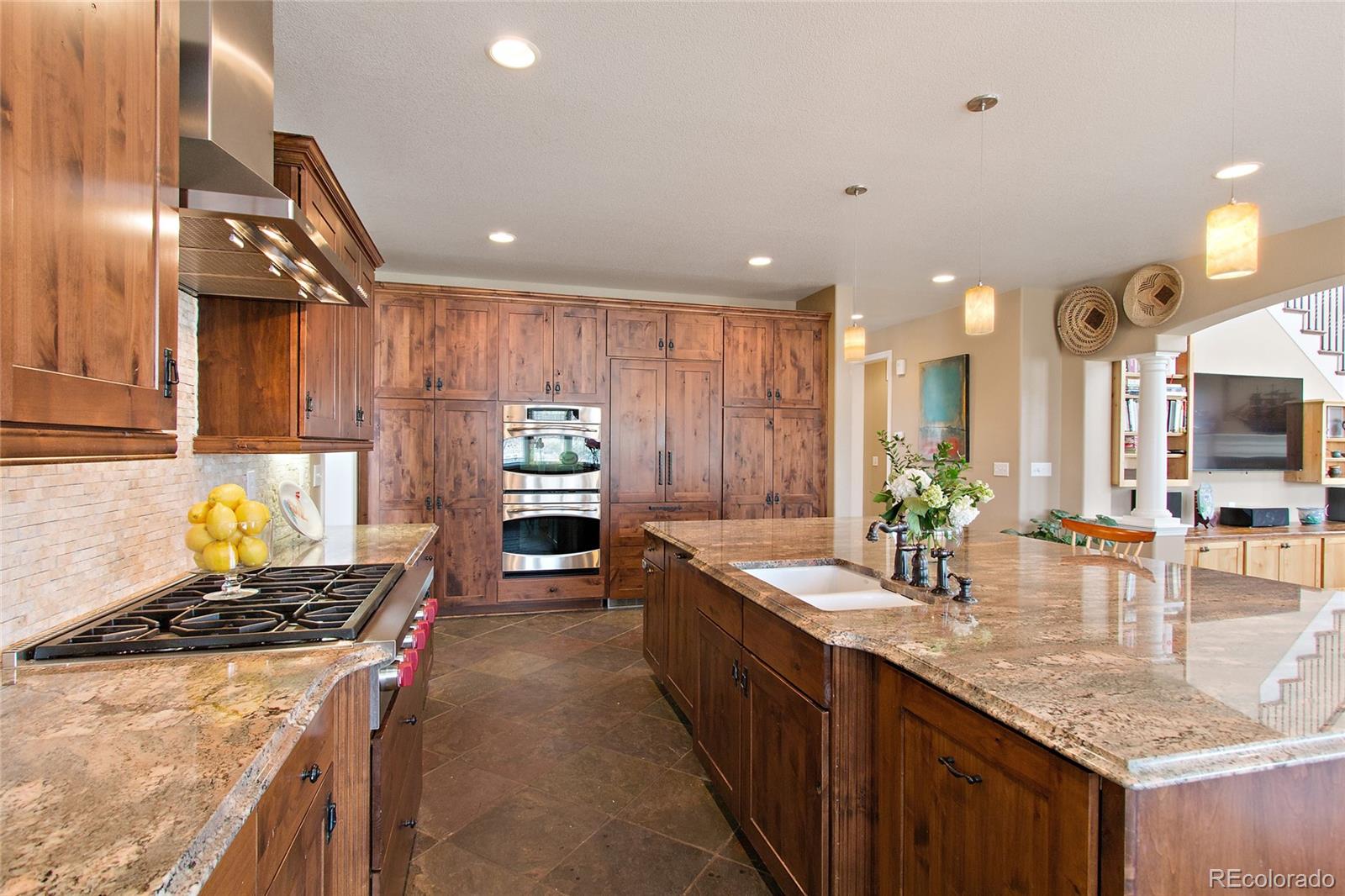 791 Elk Rest Road Evergreen, CO 80439 - Photo 12 of 35 a kitchen with sink stove and cabinets