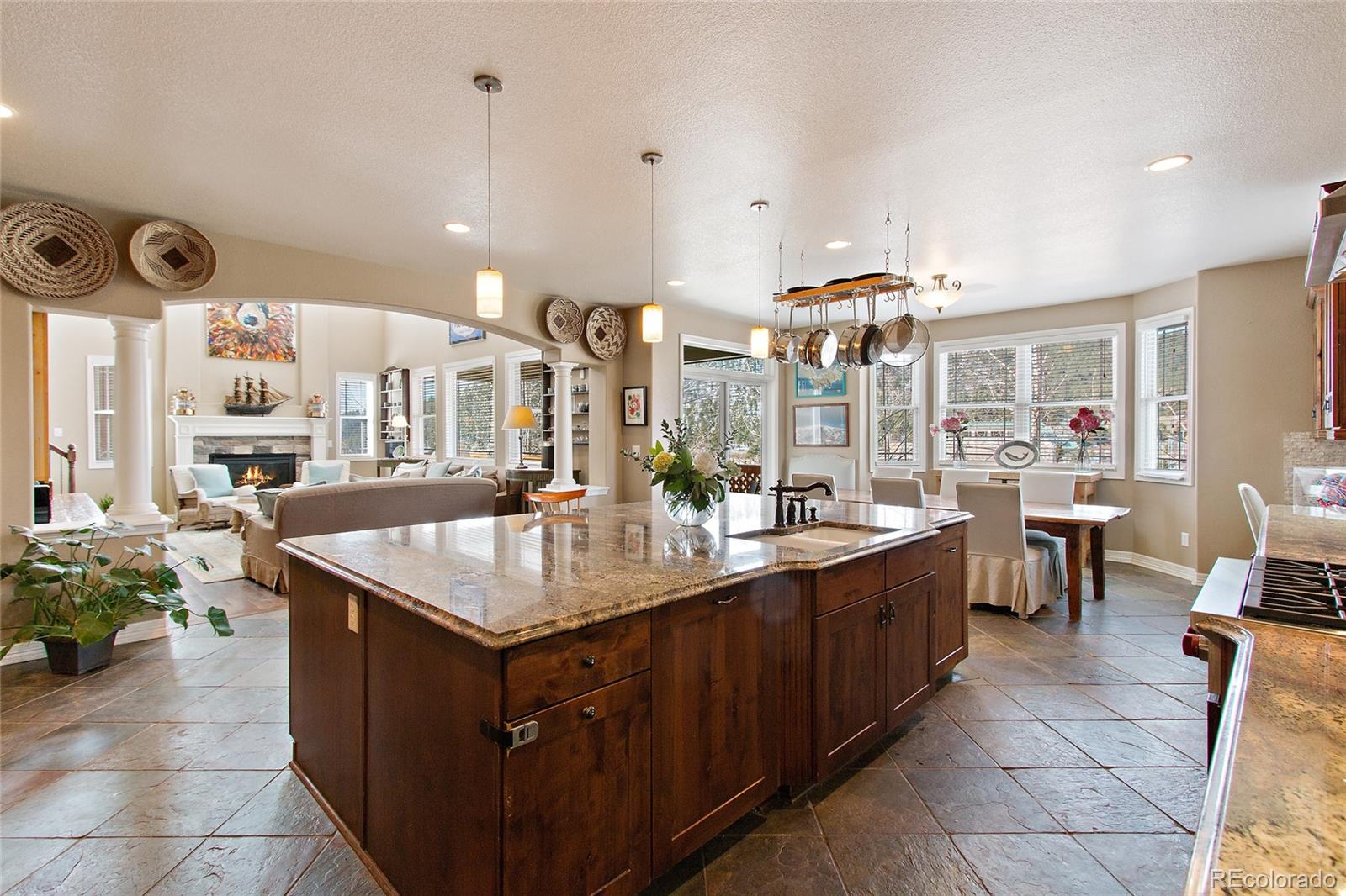 791 Elk Rest Road Evergreen, CO 80439 - Photo 15 of 35 a kitchen with cabinets a sink and a stove