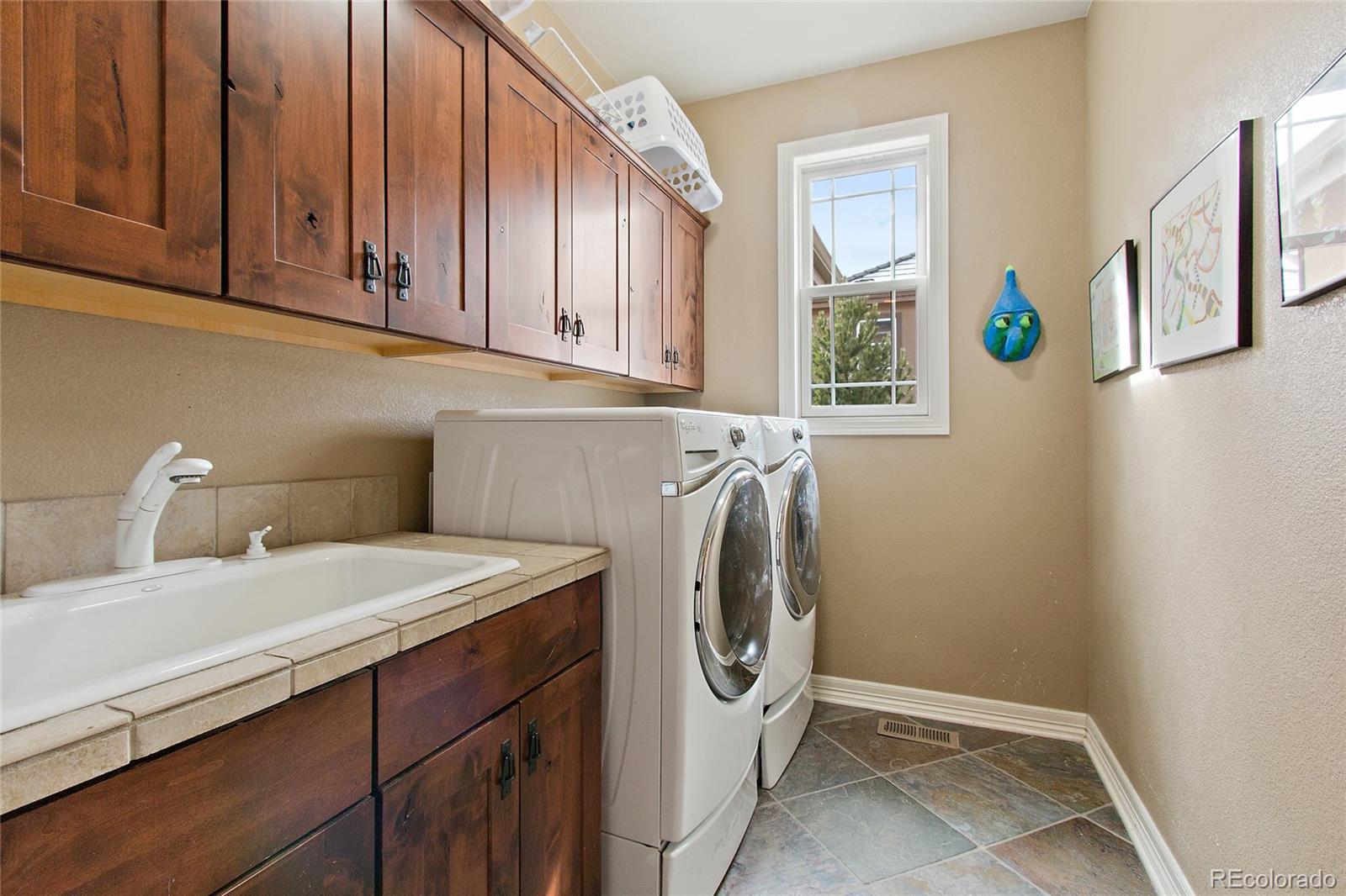 791 Elk Rest Road Evergreen, CO 80439 - Photo 17 of 35 a utility room with dryer and washer