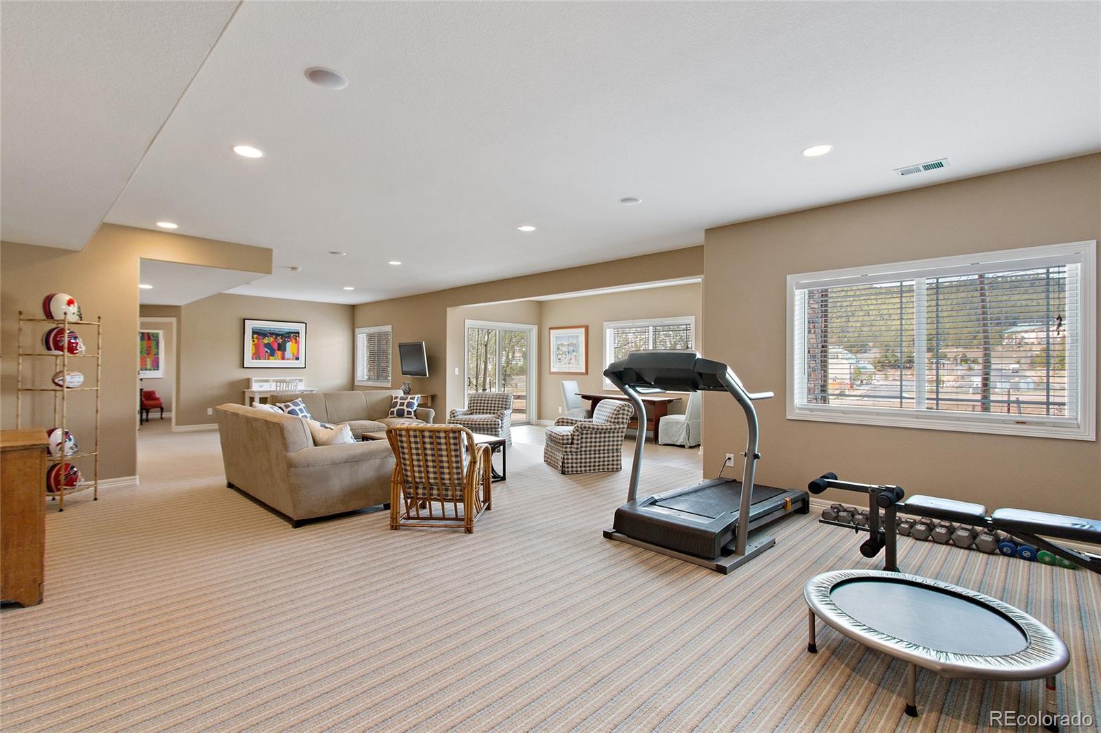 791 Elk Rest Road Evergreen, CO 80439 - Photo 27 of 35 a living room with furniture and a table
