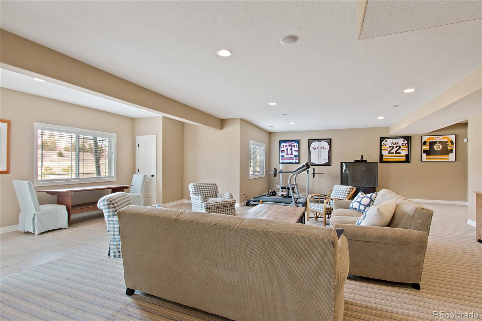 791 Elk Rest Road Evergreen, CO 80439 - Photo 29 of 35 a living room with furniture and wooden floor