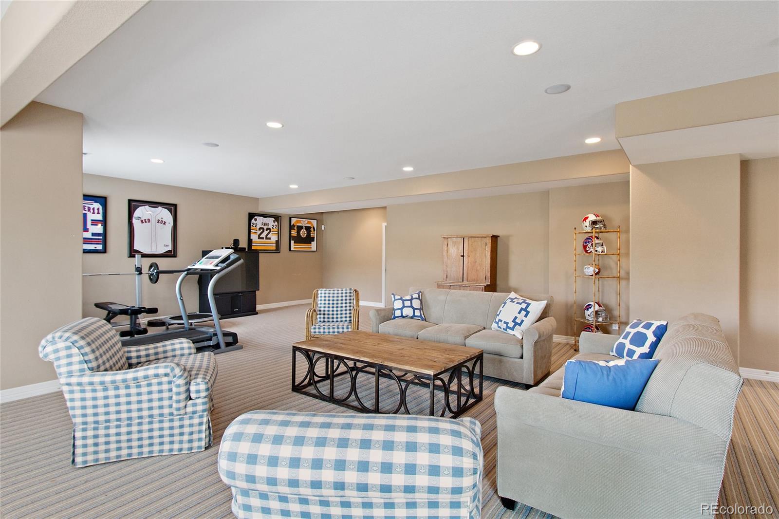 791 Elk Rest Road Evergreen, CO 80439 - Photo 30 of 35 a bedroom with furniture and wooden floor
