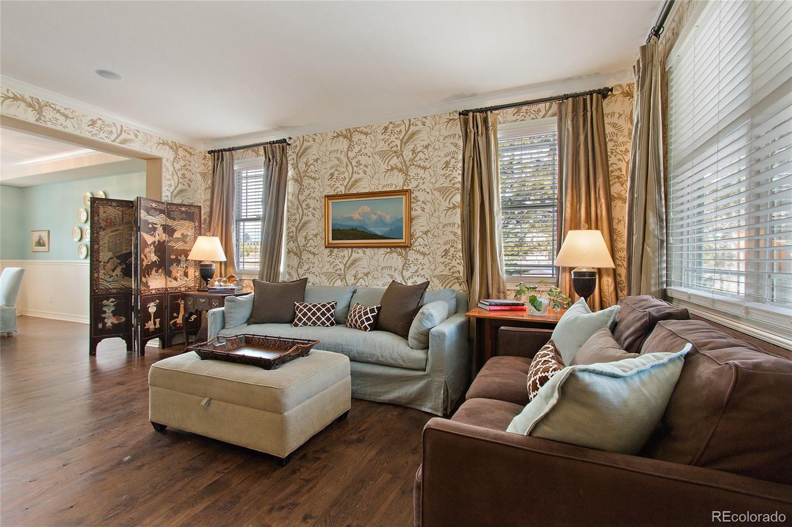 791 Elk Rest Road Evergreen, CO 80439 - Photo 3 of 35 a living room with furniture and a large window
