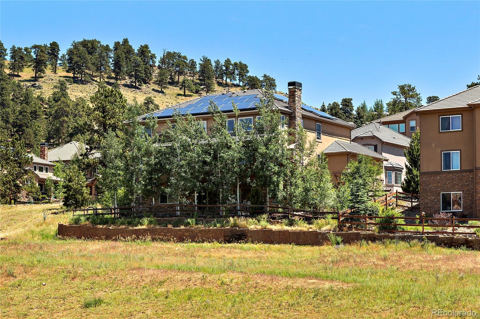 791 Elk Rest Road Evergreen, CO 80439 - Photo 34 of 35 a view of a house with a yard
