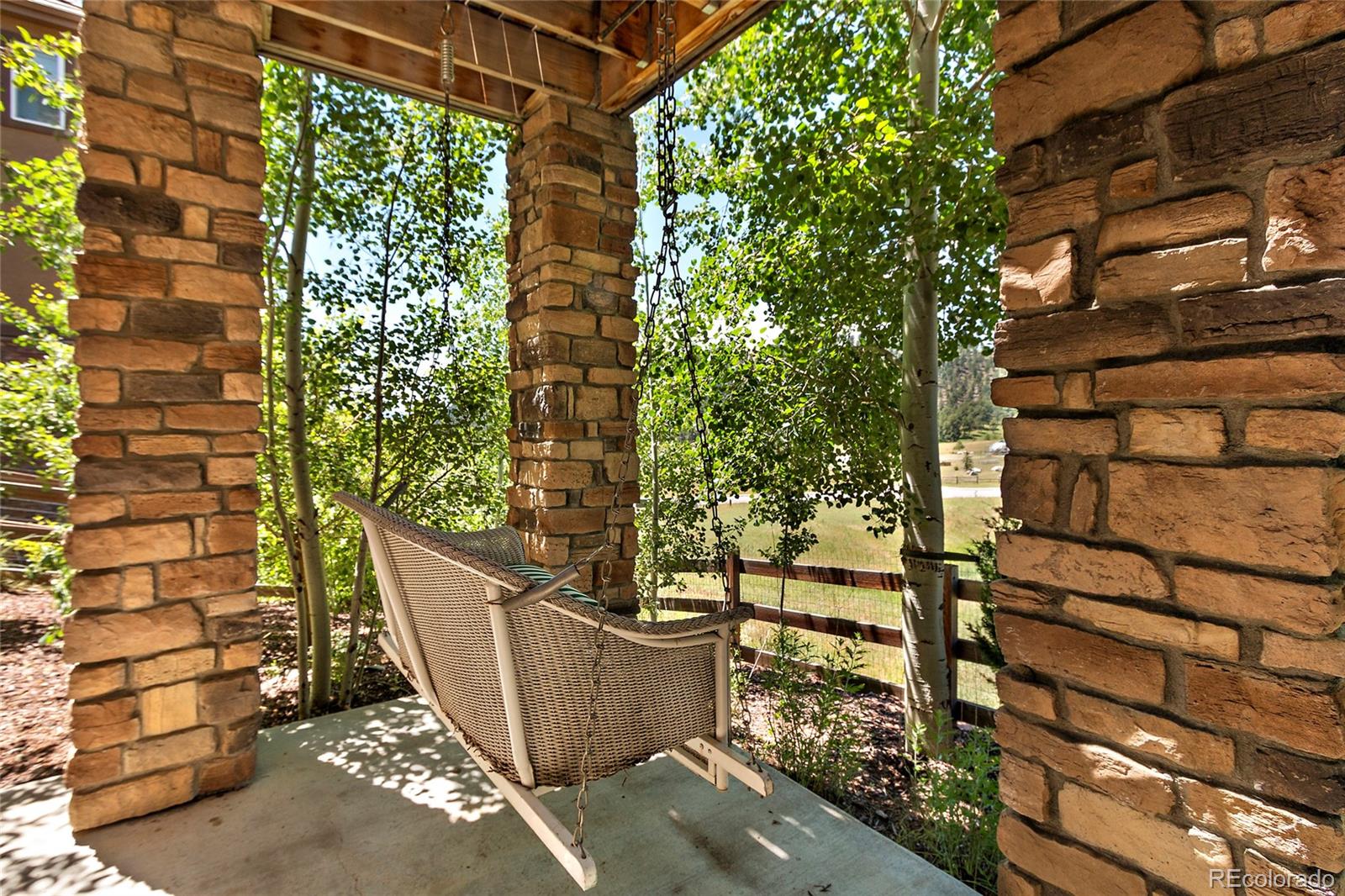 791 Elk Rest Road Evergreen, CO 80439 - Photo 35 of 35 a view of a potted plant in front of a building
