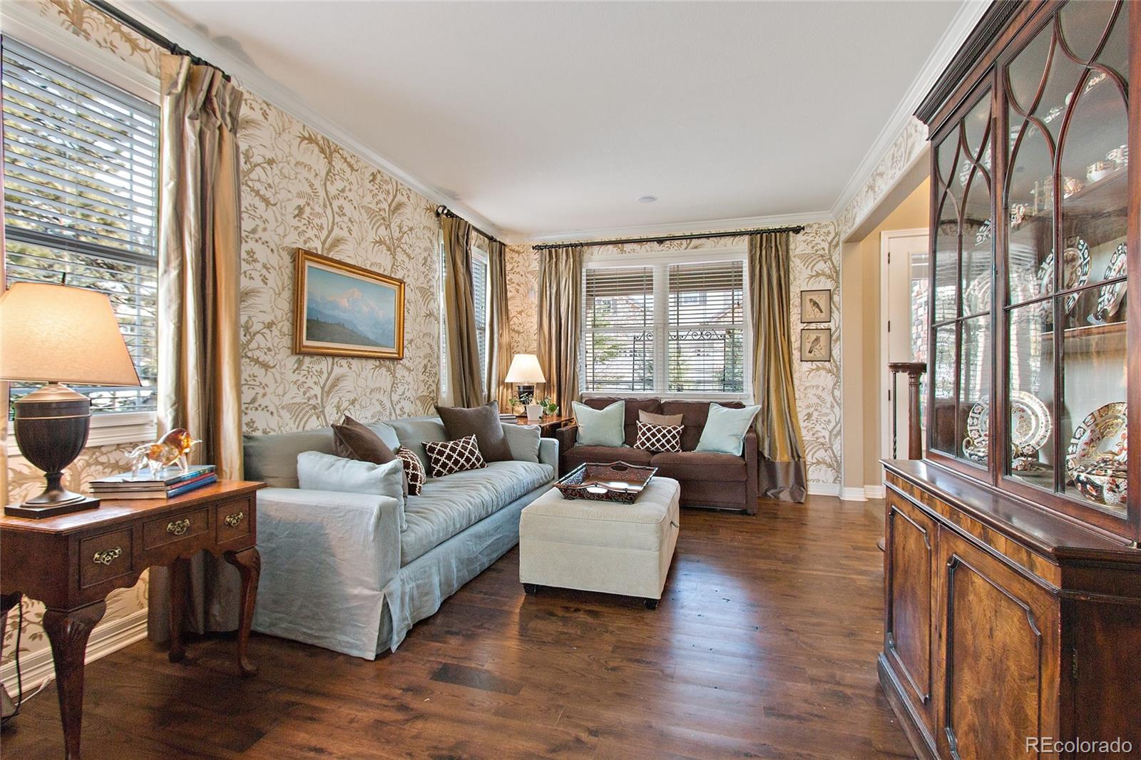 791 Elk Rest Road Evergreen, CO 80439 - Photo 6 of 35 a living room with furniture large window and wooden floor