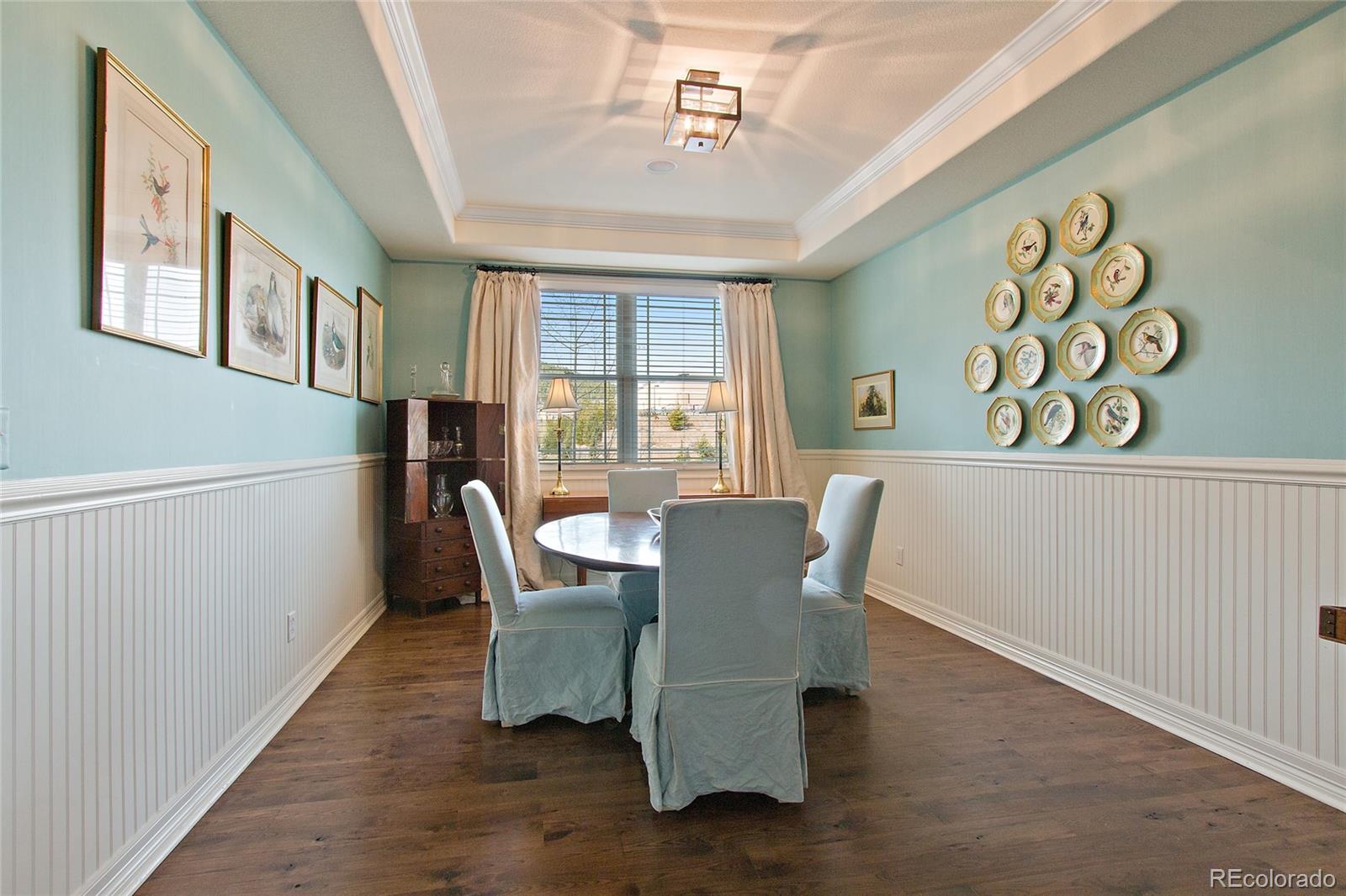 791 Elk Rest Road Evergreen, CO 80439 - Photo 7 of 35 a view of a dining room with furniture window and wooden floor