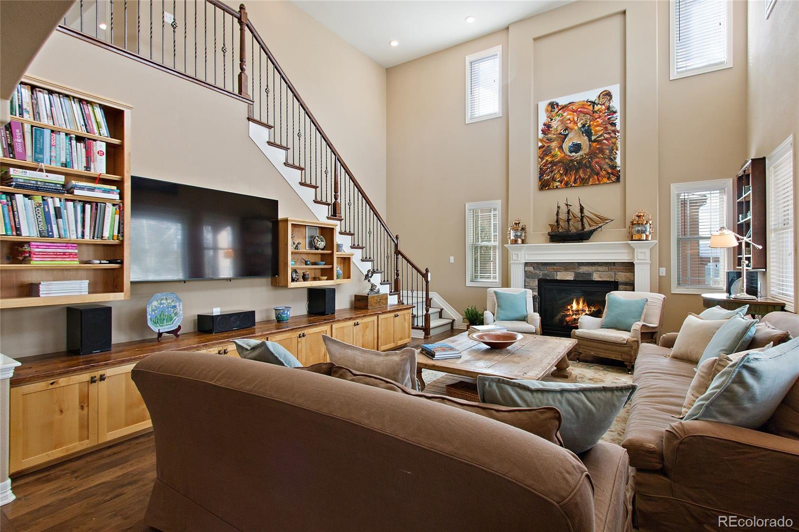 791 Elk Rest Road Evergreen, CO 80439 - Photo 8 of 35 a living room with furniture fireplace and a flat screen tv