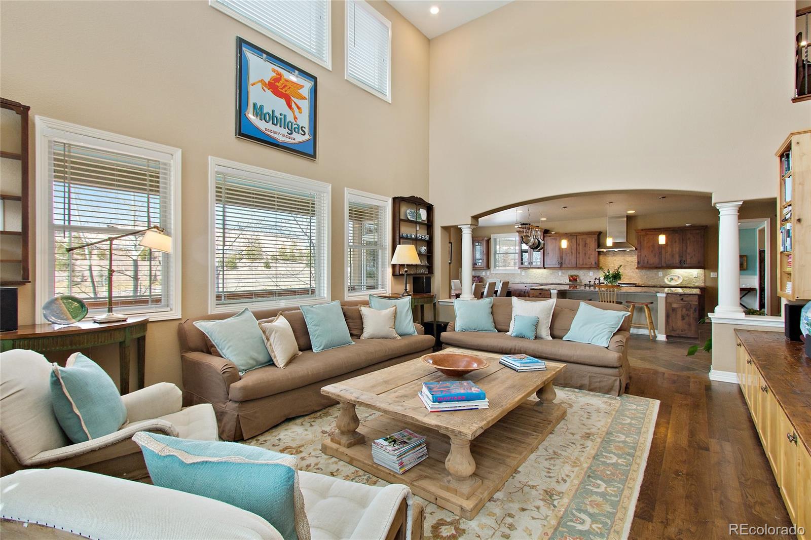 791 Elk Rest Road Evergreen, CO 80439 - Photo 9 of 35 a living room with furniture wooden floor and a table