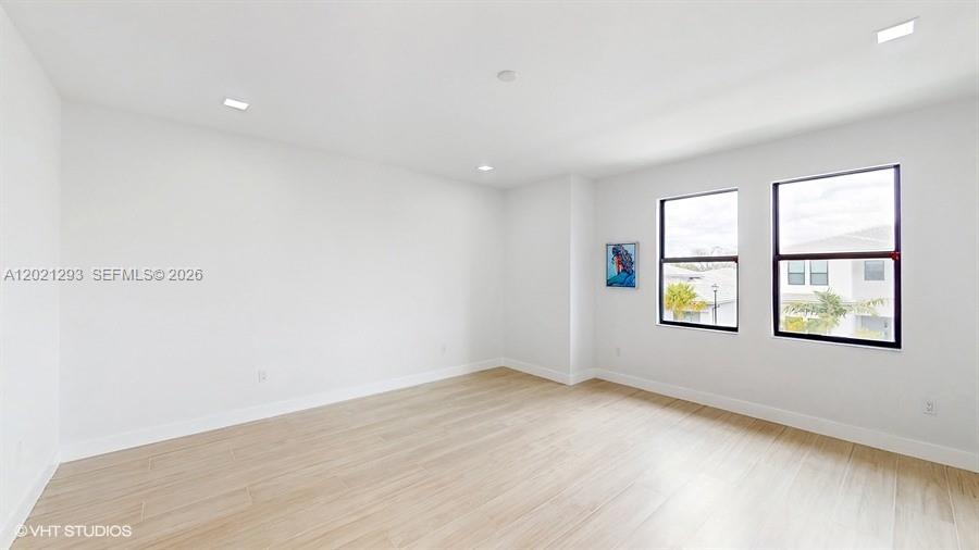 8350 Royal County Down Road Boca Raton, FL 33434 - Photo 24 of 52 an empty room with windows