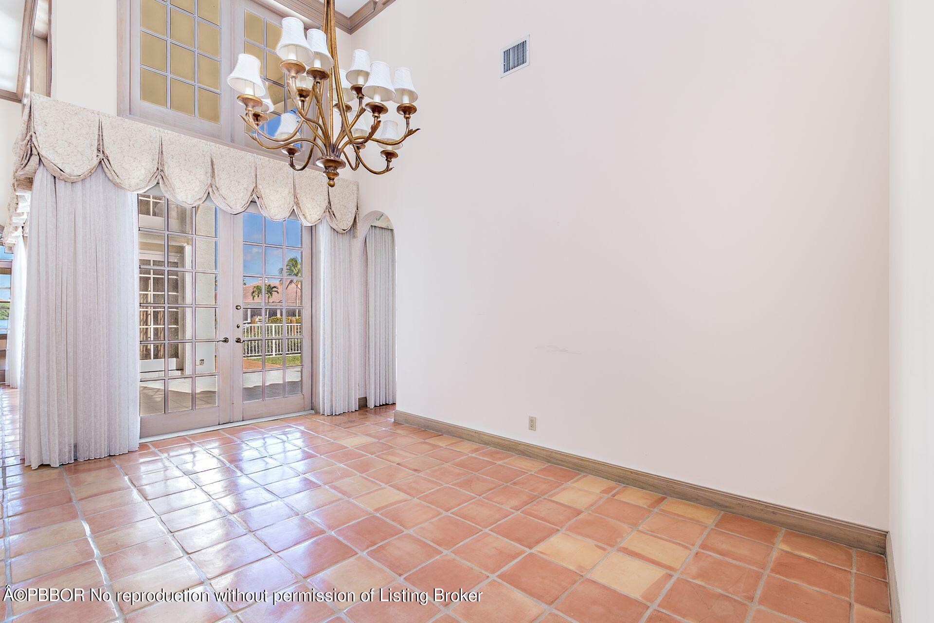 3299 Bridgegate Drive Jupiter, FL 33477 - Photo 14 of 48 a view of entryway with wooden floor