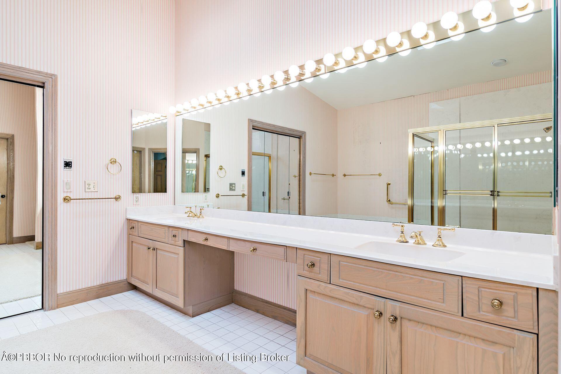 3299 Bridgegate Drive Jupiter, FL 33477 - Photo 18 of 48 a bathroom with a sink double vanity and a mirror