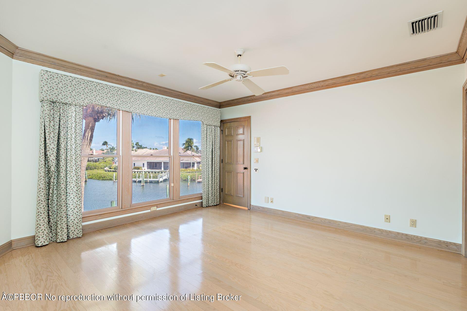 3299 Bridgegate Drive Jupiter, FL 33477 - Photo 24 of 48 a view of a kitchen with furniture and a ceiling fan