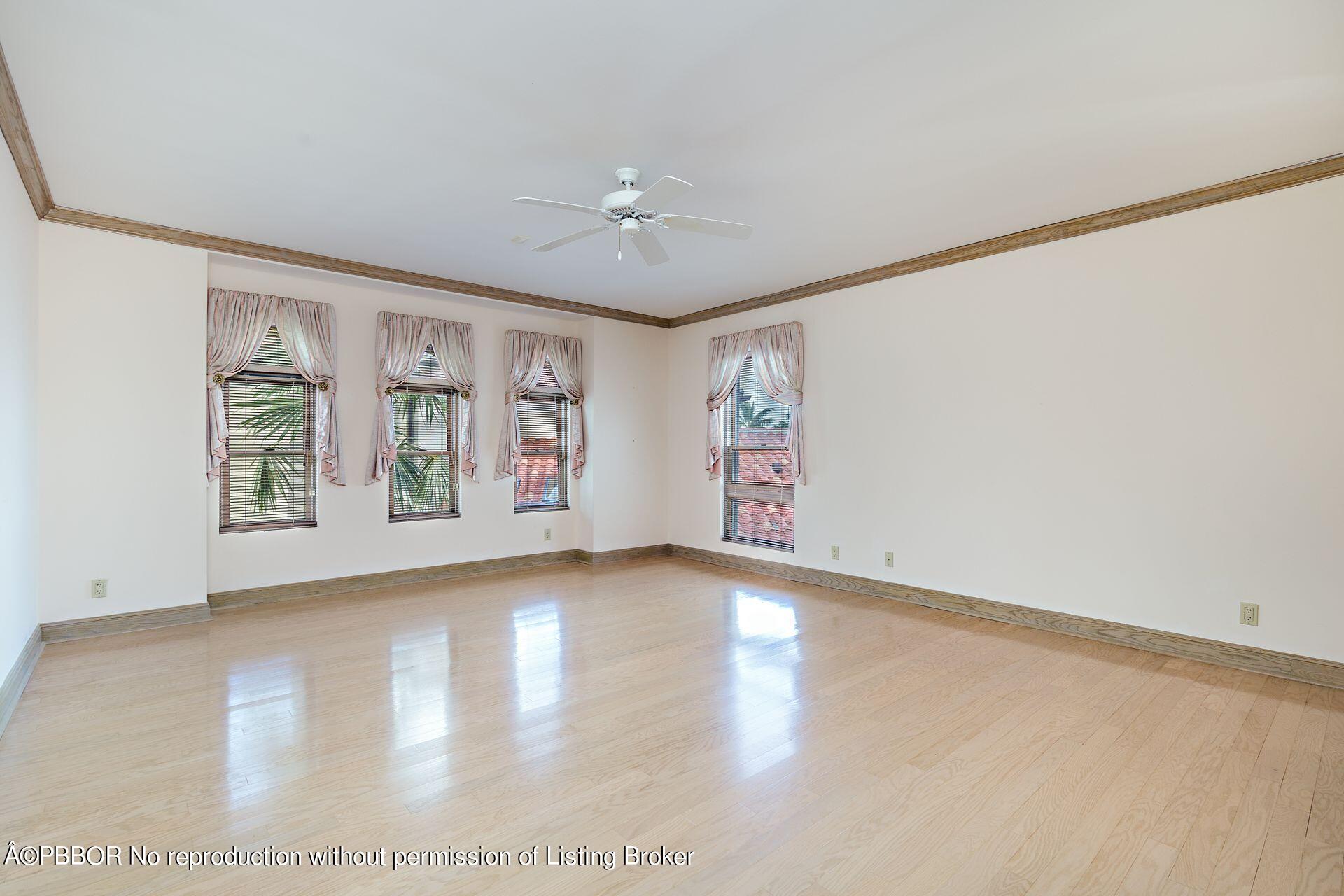 3299 Bridgegate Drive Jupiter, FL 33477 - Photo 26 of 48 wooden floor in an empty room with a window