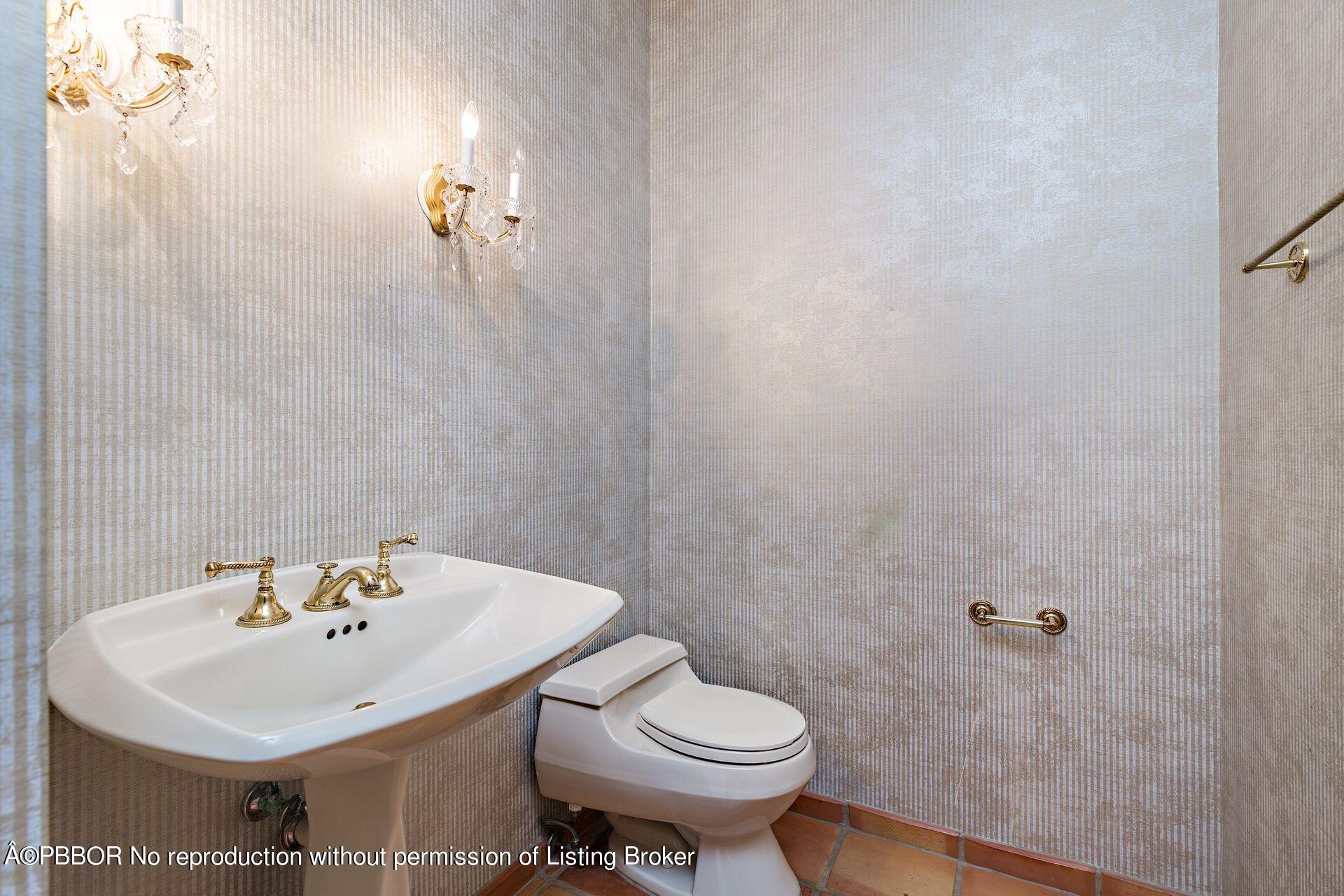 3299 Bridgegate Drive Jupiter, FL 33477 - Photo 28 of 48 a bathroom with a sink and a toilet