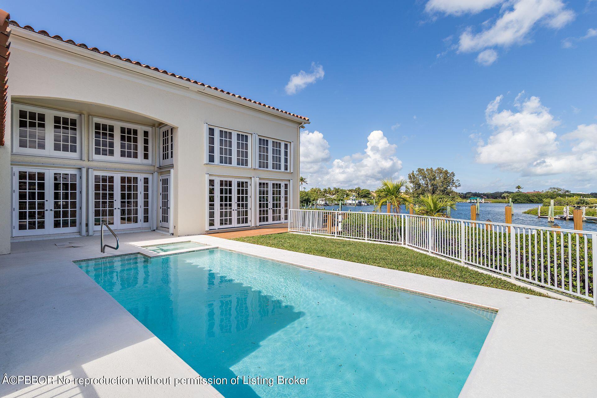 3299 Bridgegate Drive Jupiter, FL 33477 - Photo 31 of 48 a view of a house with a swimming pool