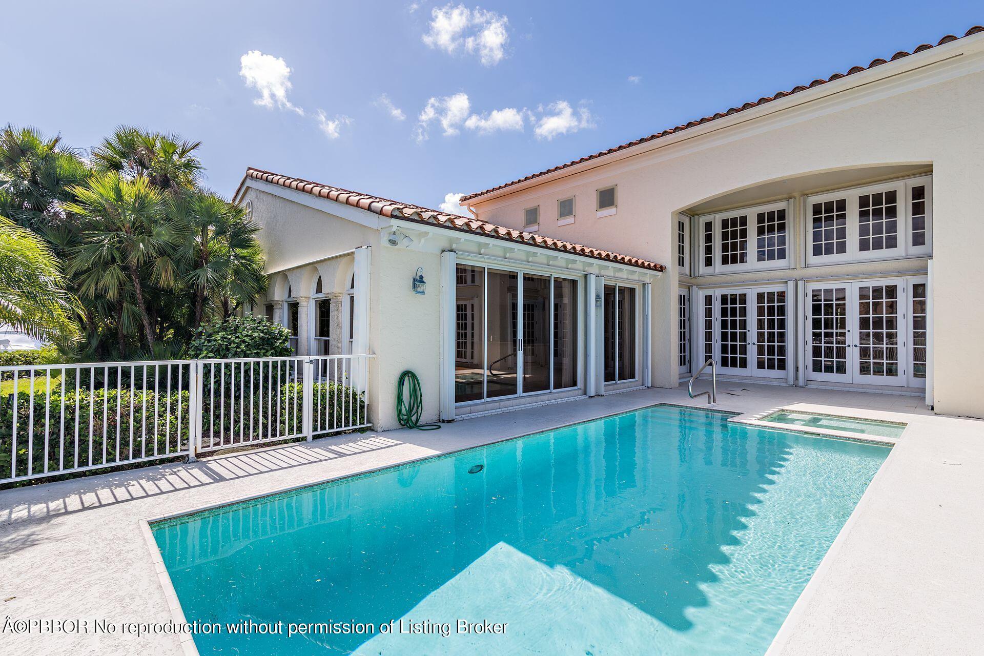 3299 Bridgegate Drive Jupiter, FL 33477 - Photo 32 of 48 a view of a house with swimming pool and porch