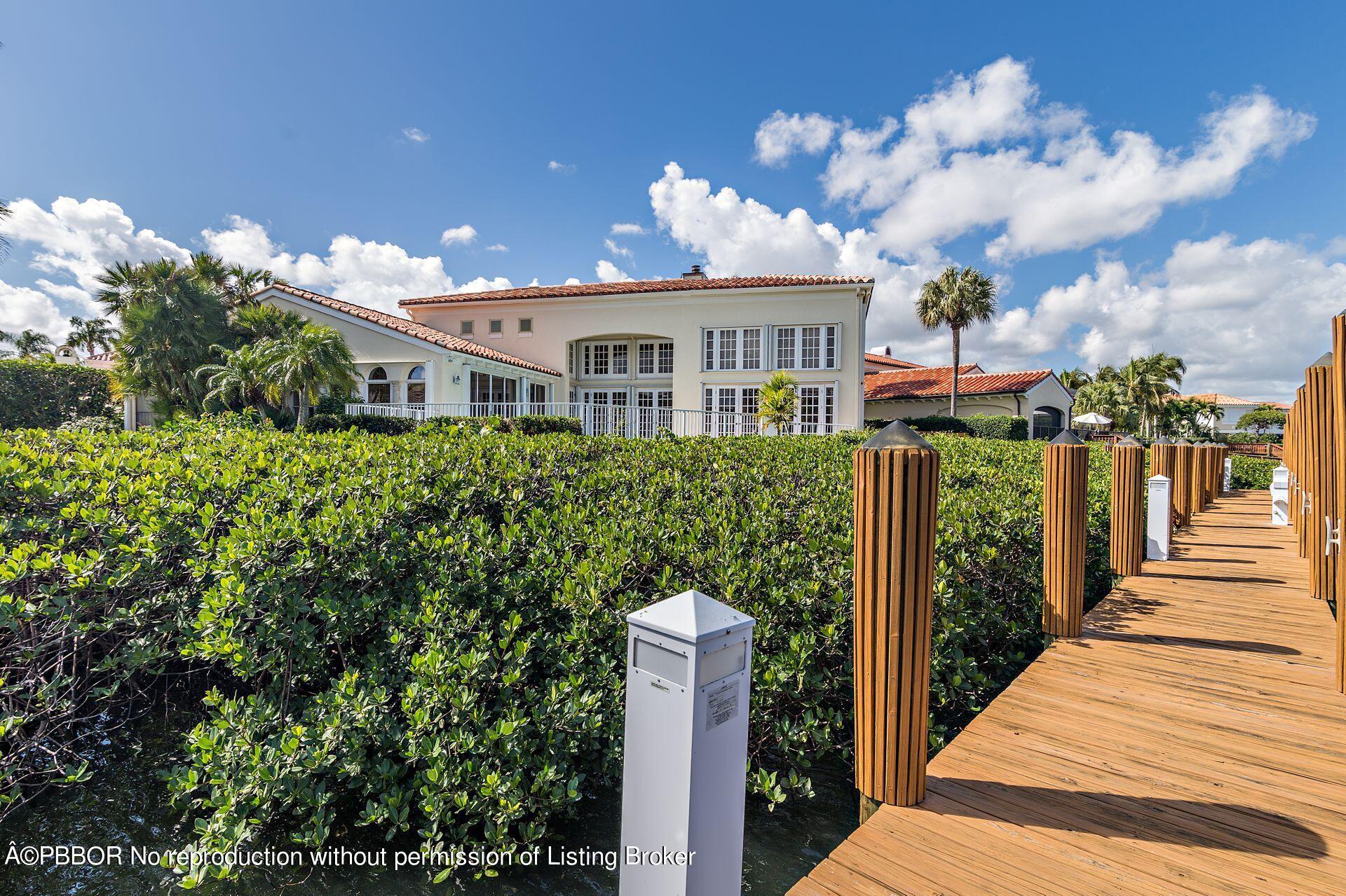 3299 Bridgegate Drive Jupiter, FL 33477 - Photo 36 of 48 a front view of a house with a yard