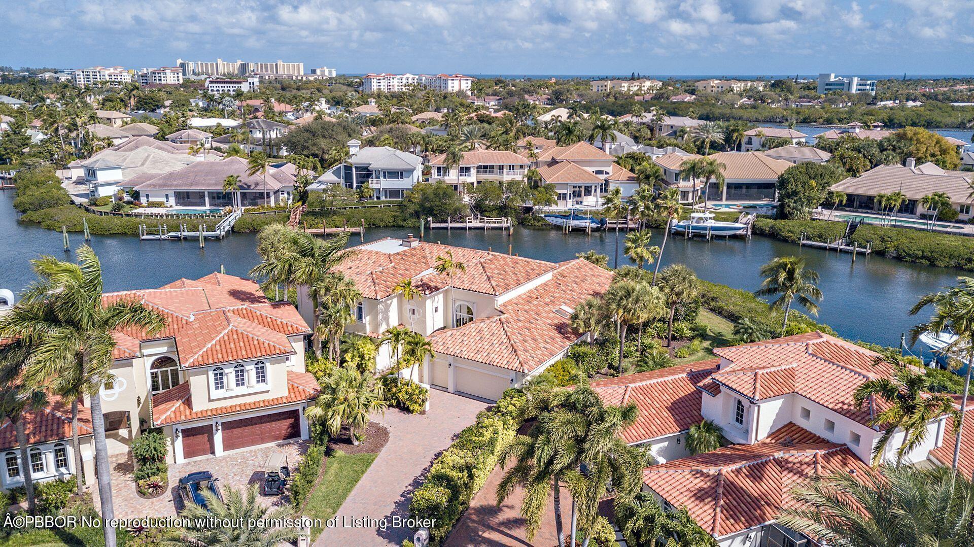 3299 Bridgegate Drive Jupiter, FL 33477 - Photo 38 of 48 an aerial view of residential houses with outdoor space and lake view