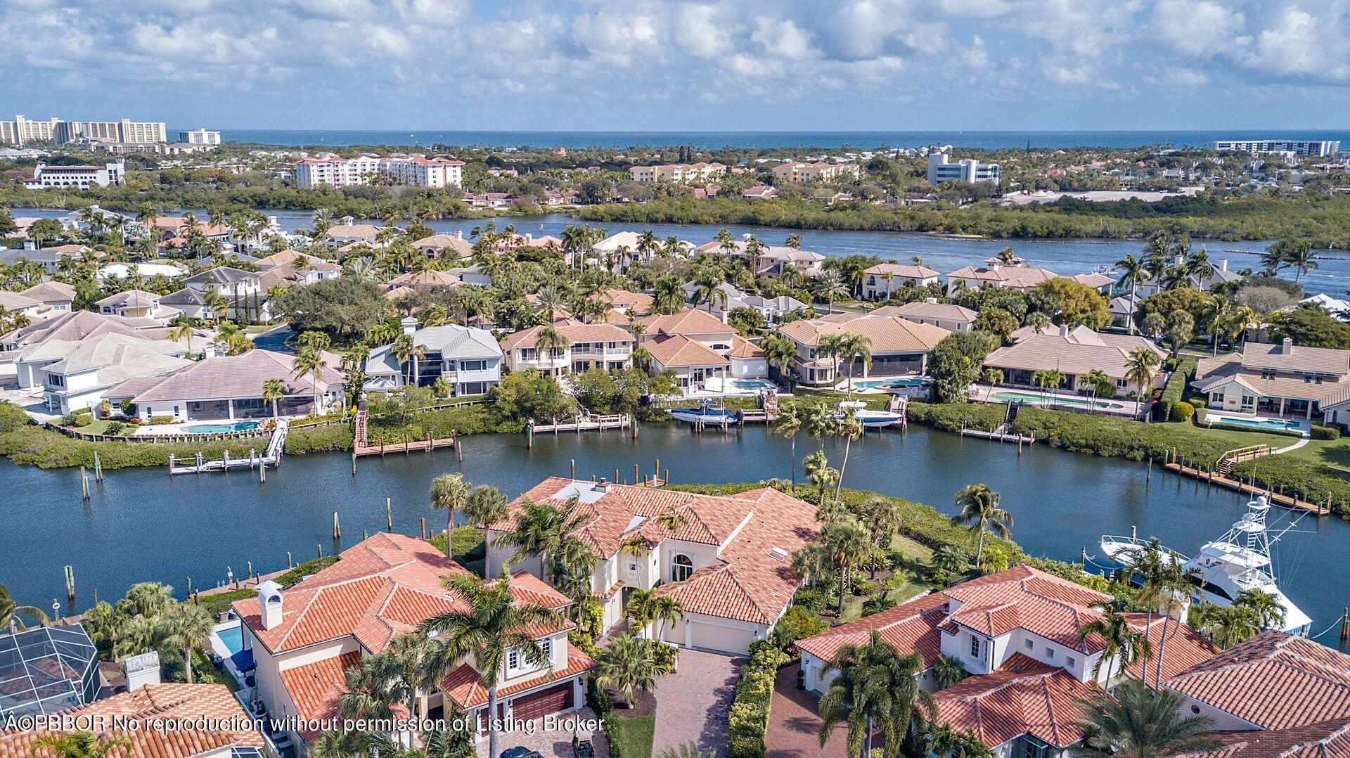3299 Bridgegate Drive Jupiter, FL 33477 - Photo 39 of 48 an aerial view of ocean and residential houses with outdoor space