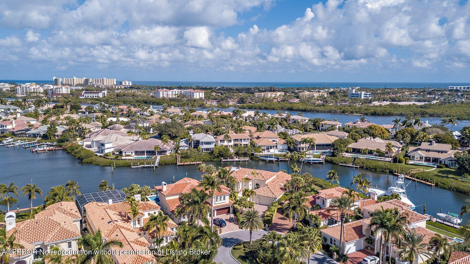 3299 Bridgegate Drive Jupiter, FL 33477 - Photo 41 of 48 an aerial view of a city with ocean view