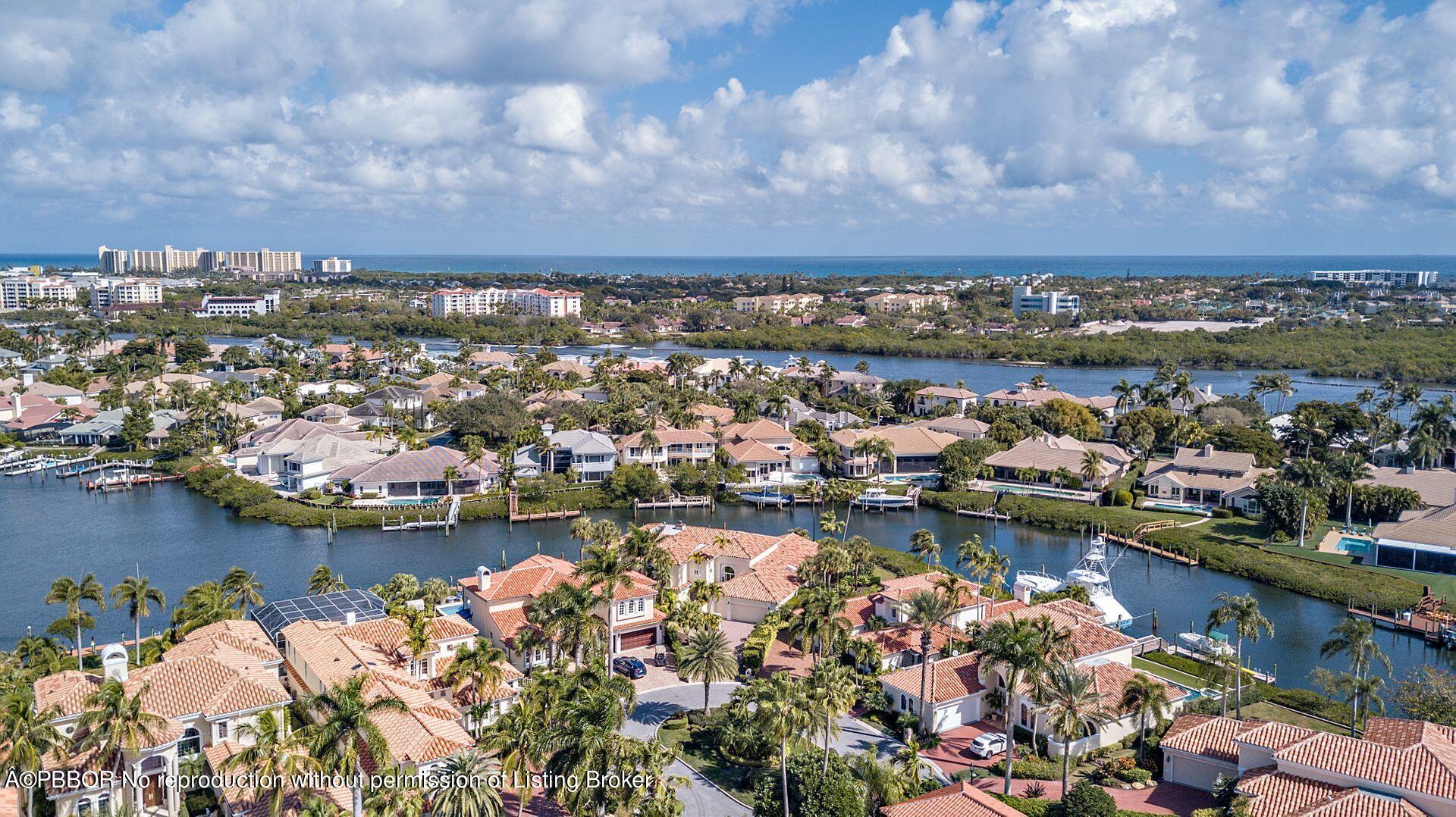 3299 Bridgegate Drive Jupiter, FL 33477 - Photo 42 of 48 an aerial view of a city with lots of residential buildings lake and ocean view