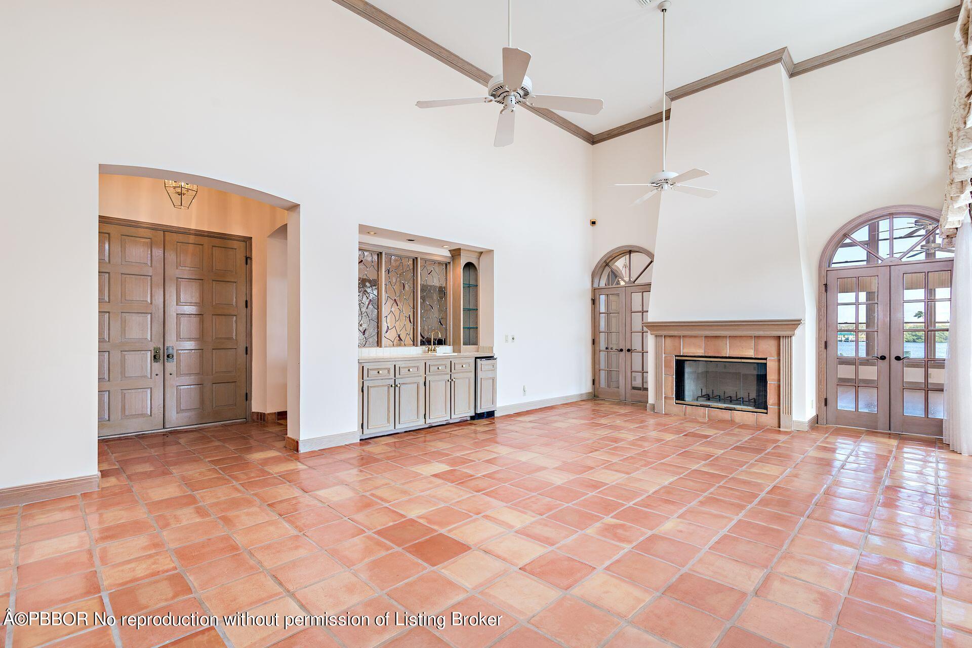 3299 Bridgegate Drive Jupiter, FL 33477 - Photo 6 of 48 a view of a livingroom with wooden floor and a fireplace