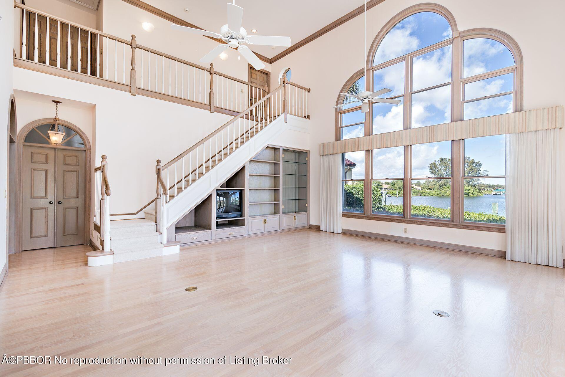 3299 Bridgegate Drive Jupiter, FL 33477 - Photo 7 of 48 a view of entryway and hall with wooden floor