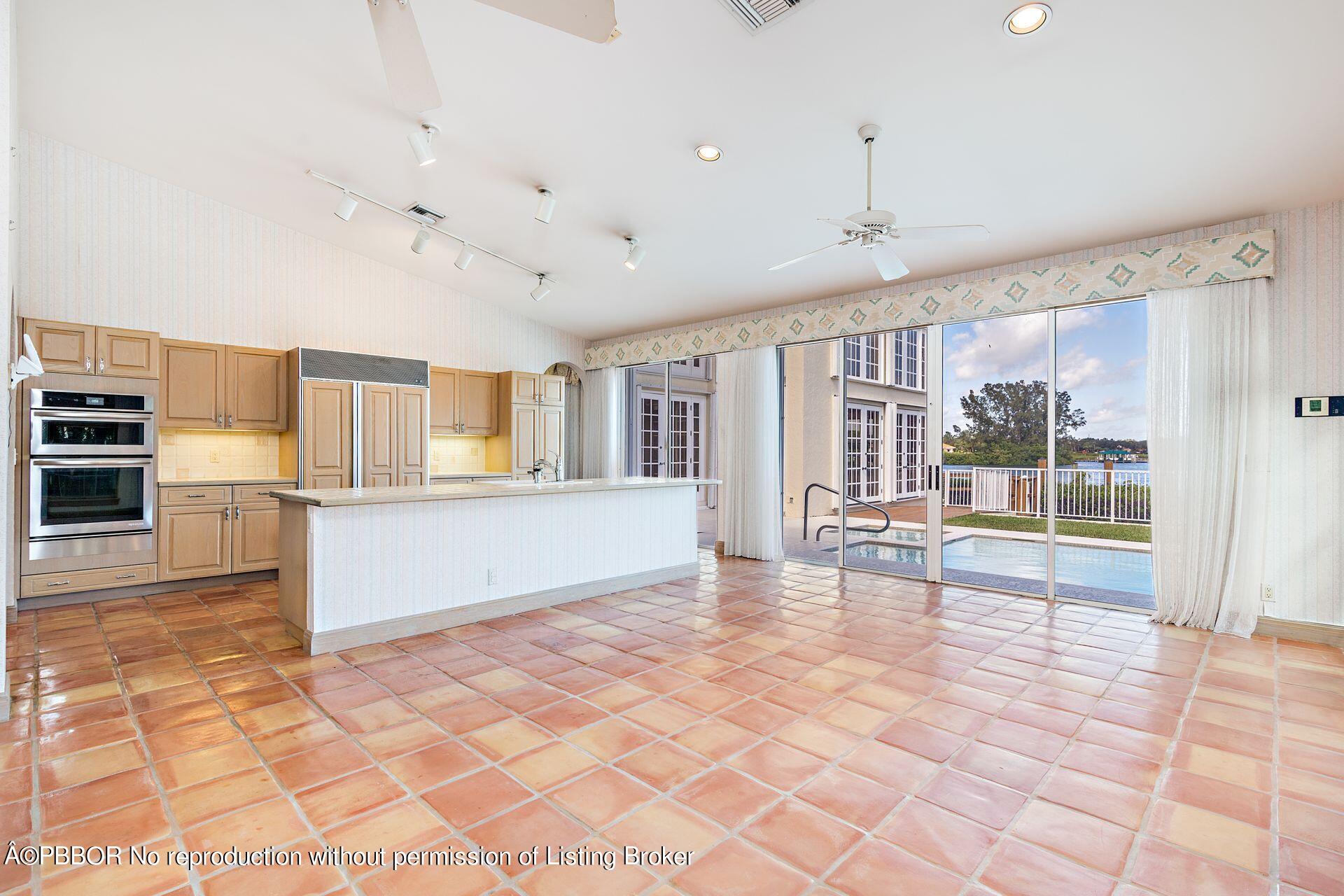 3299 Bridgegate Drive Jupiter, FL 33477 - Photo 9 of 48 a view of empty room with wooden floor and fireplace