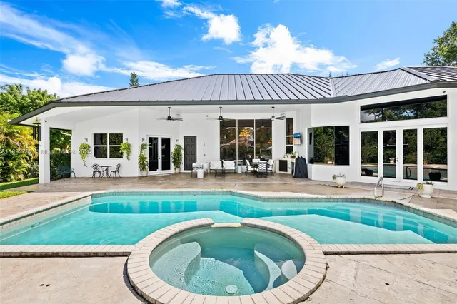 a view of a house with a swimming pool
