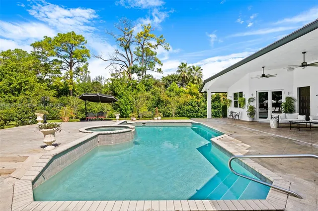 a view of a swimming pool with a patio