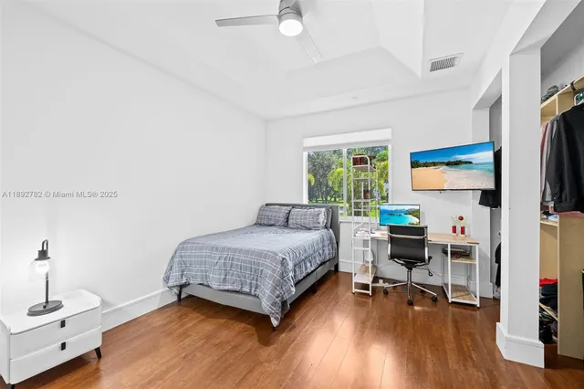 a bathroom with a shower sink and mirror