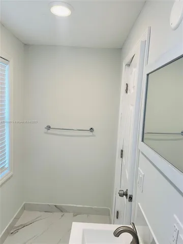 a view of a room that has a window in it