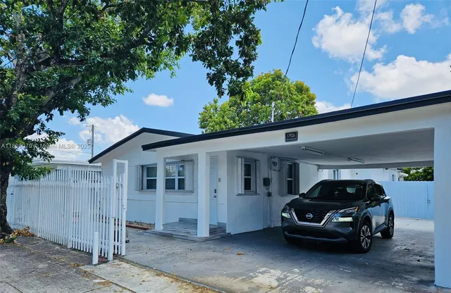 a car parked in front of a house