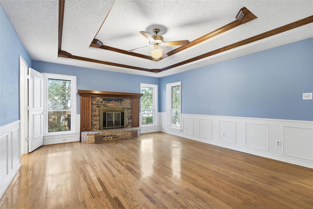 6140 Dick Price Road Fort Worth, TX 76140 - Photo 16 of 40 a view of an empty room with a window and wooden floor