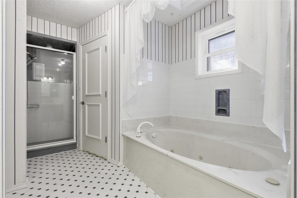 6140 Dick Price Road Fort Worth, TX 76140 - Photo 19 of 40 a bathroom with a bathtub and a shower