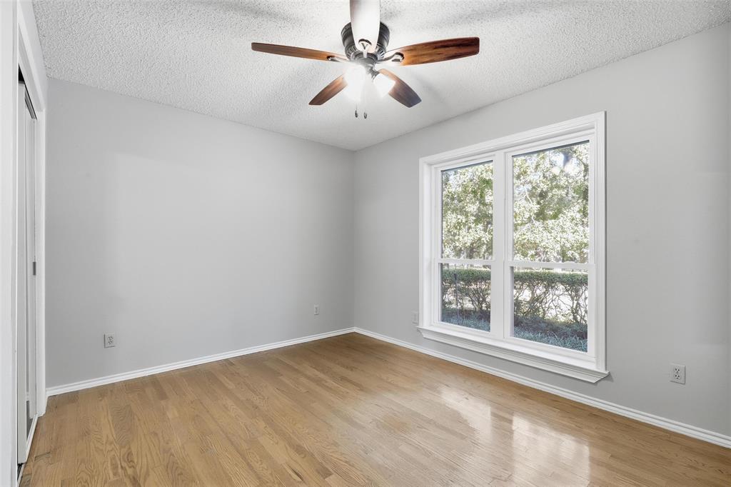 6140 Dick Price Road Fort Worth, TX 76140 - Photo 20 of 40 an empty room with windows and ceiling fan