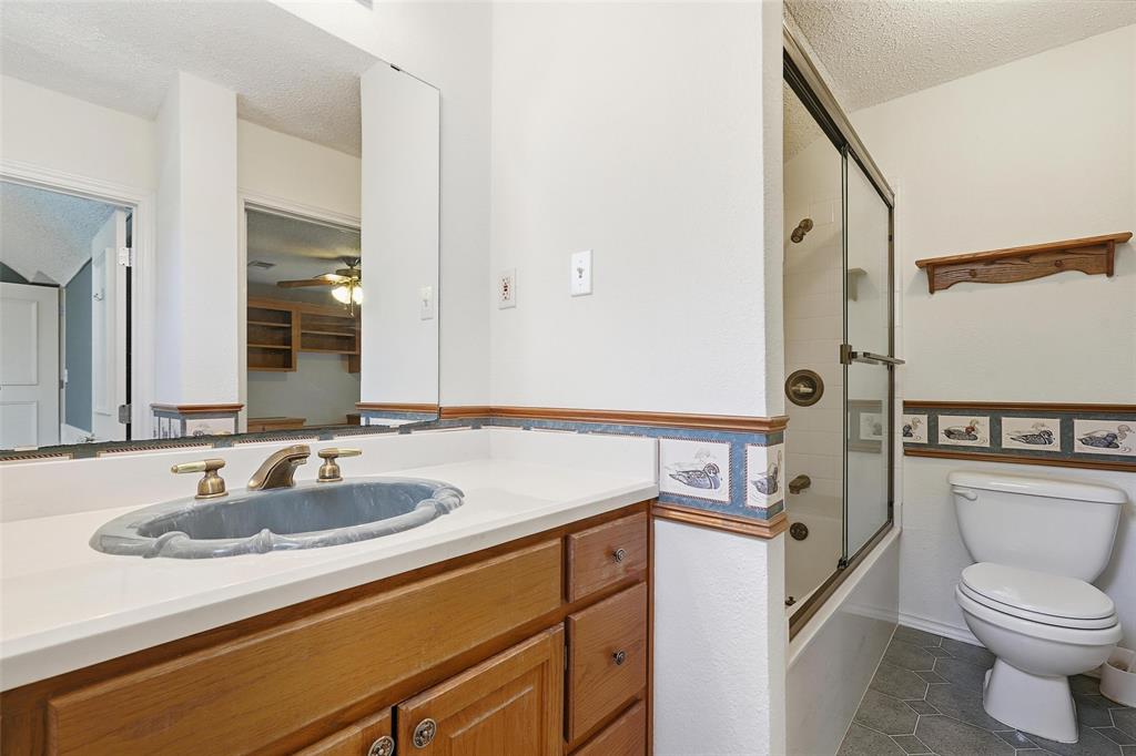 6140 Dick Price Road Fort Worth, TX 76140 - Photo 24 of 40 a bathroom with a sink a toilet and shower