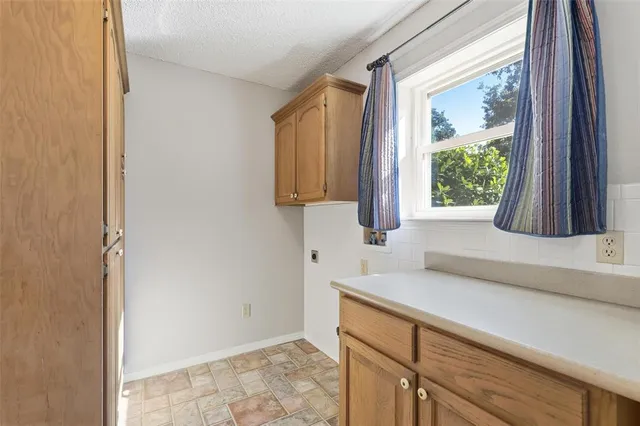 a kitchen with a sink and a window
