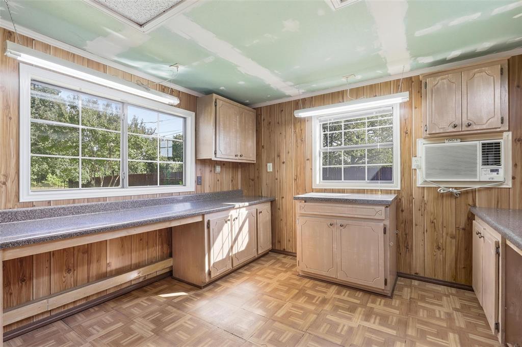 6140 Dick Price Road Fort Worth, TX 76140 - Photo 35 of 40 a kitchen with stainless steel appliances granite countertop a stove a sink and a microwave