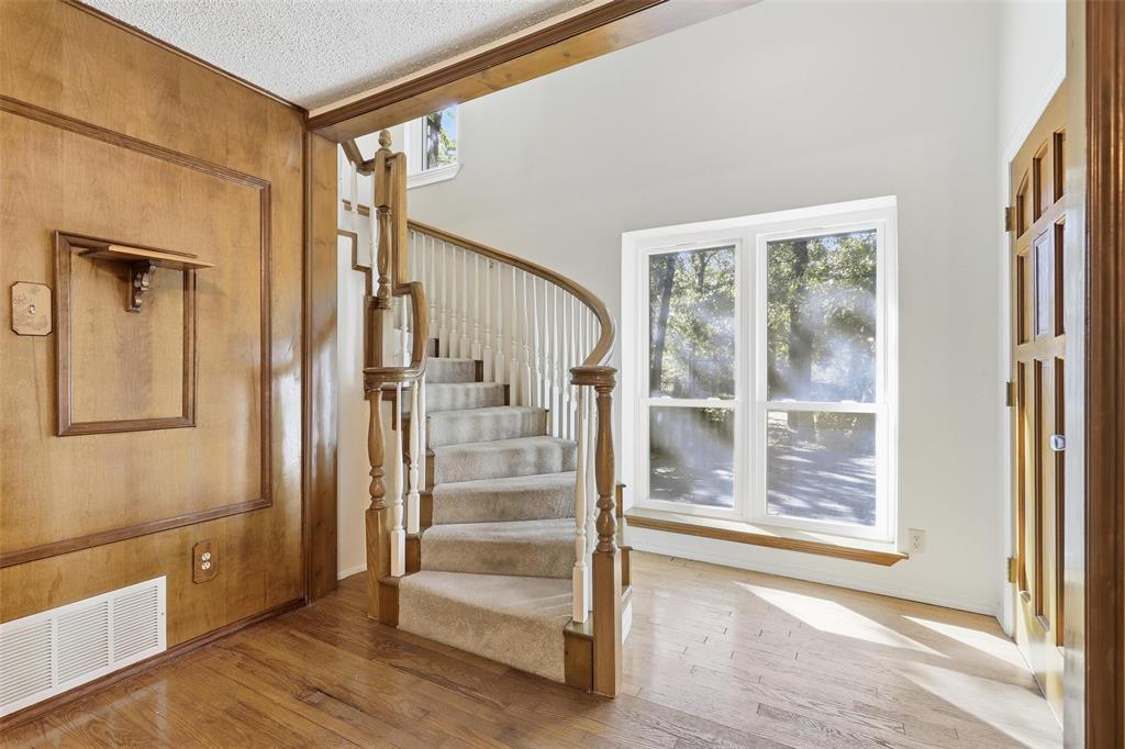 6140 Dick Price Road Fort Worth, TX 76140 - Photo 7 of 40 a view of an entryway with wooden floor and door