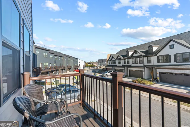 a view of a balcony with furniture