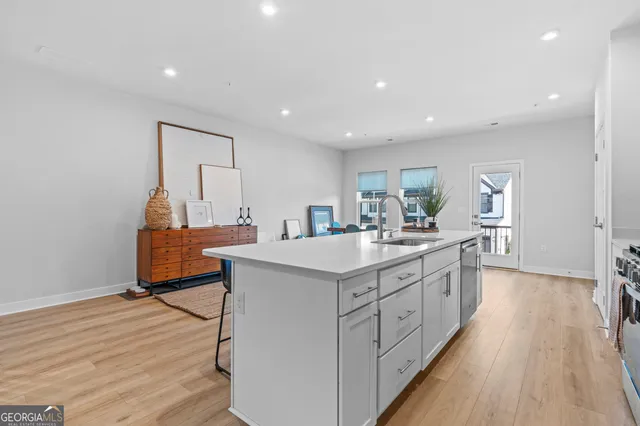 a kitchen with counter top space and sink