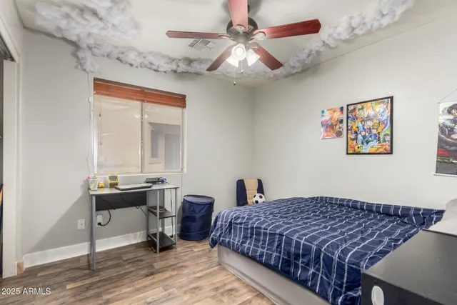 a bedroom with bed and a window