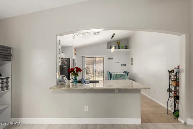 a view of living room with furniture and potted plant