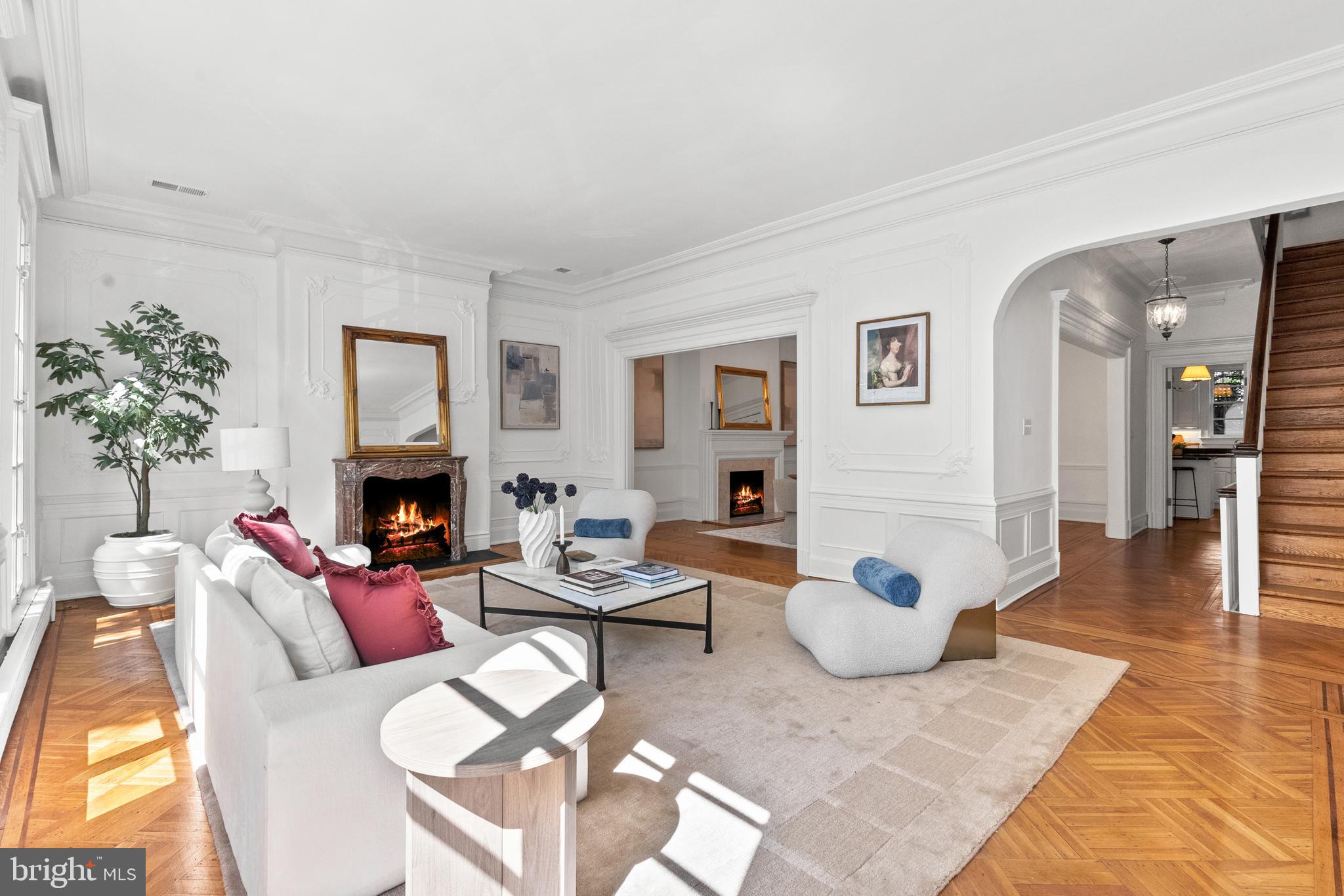 2125 Bancroft Place Northwest Washington, DC 20008 - Photo 15 of 48 a living room with furniture a fireplace and a potted plant
