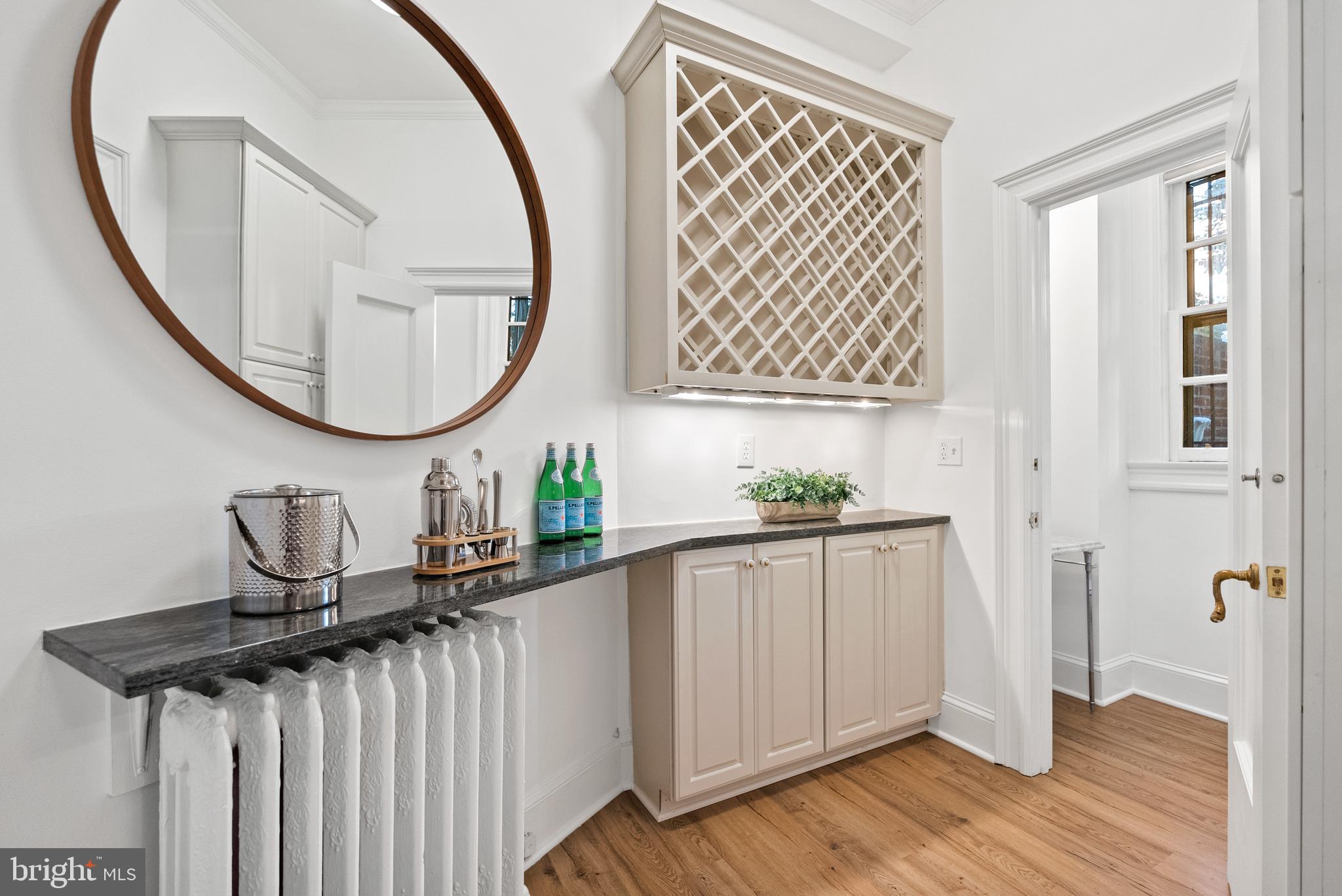 2125 Bancroft Place Northwest Washington, DC 20008 - Photo 19 of 48 an entryway with wooden floor and mirror